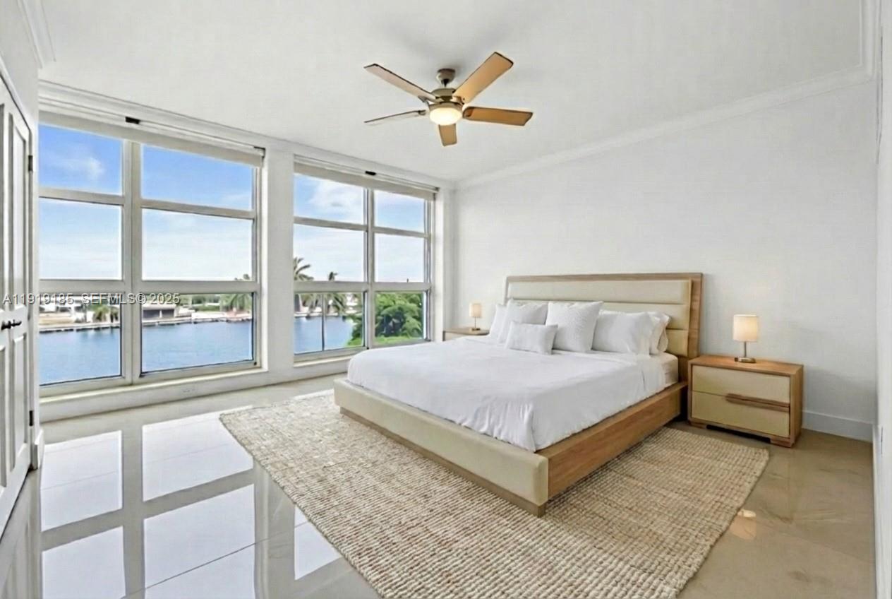 5055 Collins Avenue, Unit 6M Miami Beach, FL 33140 - Photo 15 of 42 a bedroom with a bed and window