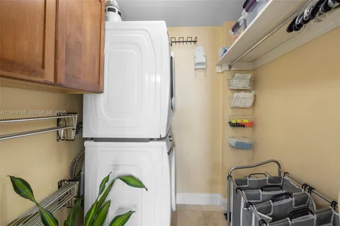 a view of storage and utility room with washer and dryer