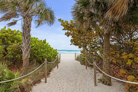 a view of swimming pool with outdoor seating and city view