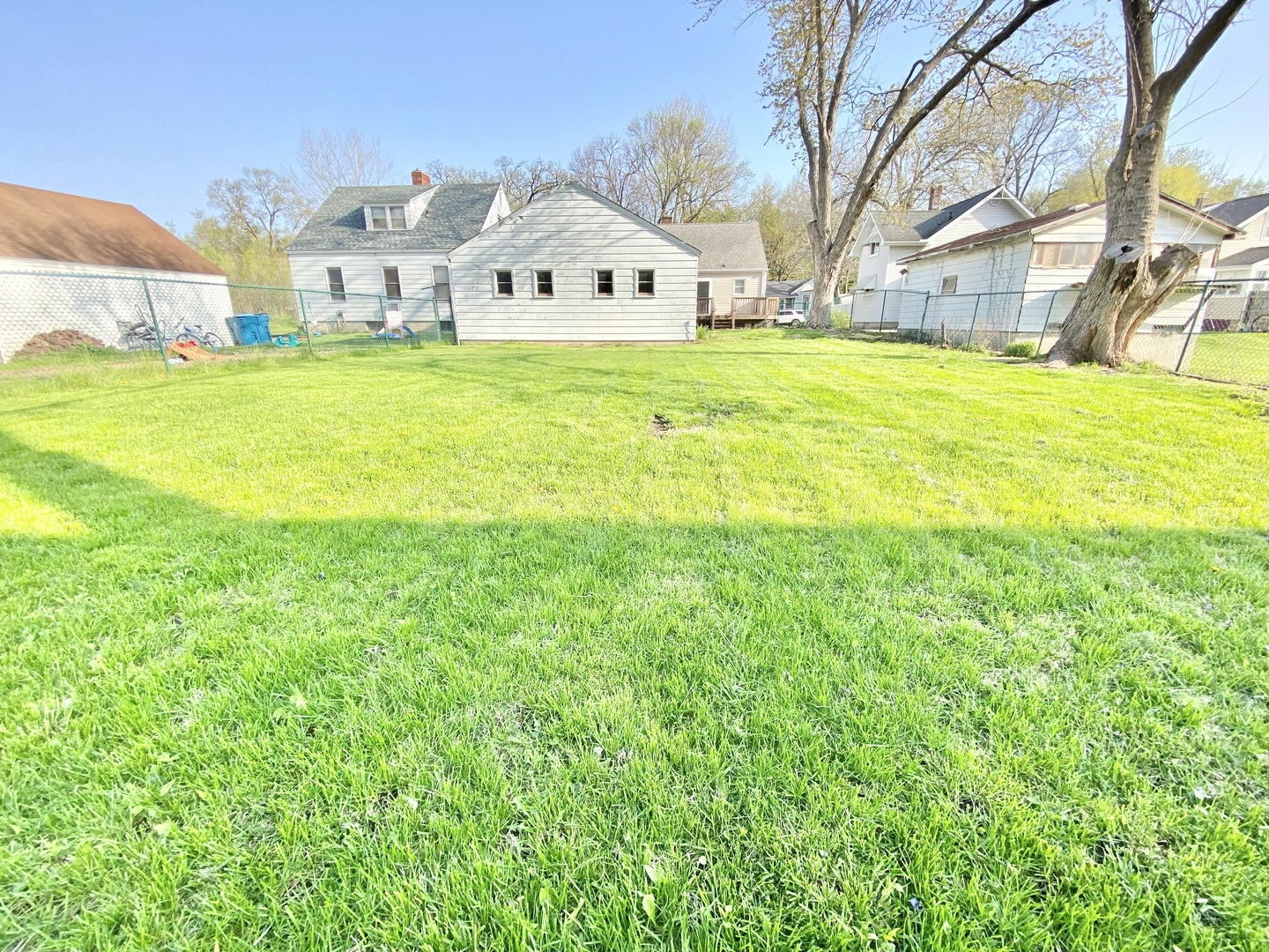 322 West Morgan Street Dixon, IL 61021 - Photo 5 of 20 a front view of a house with a big yard and large trees
