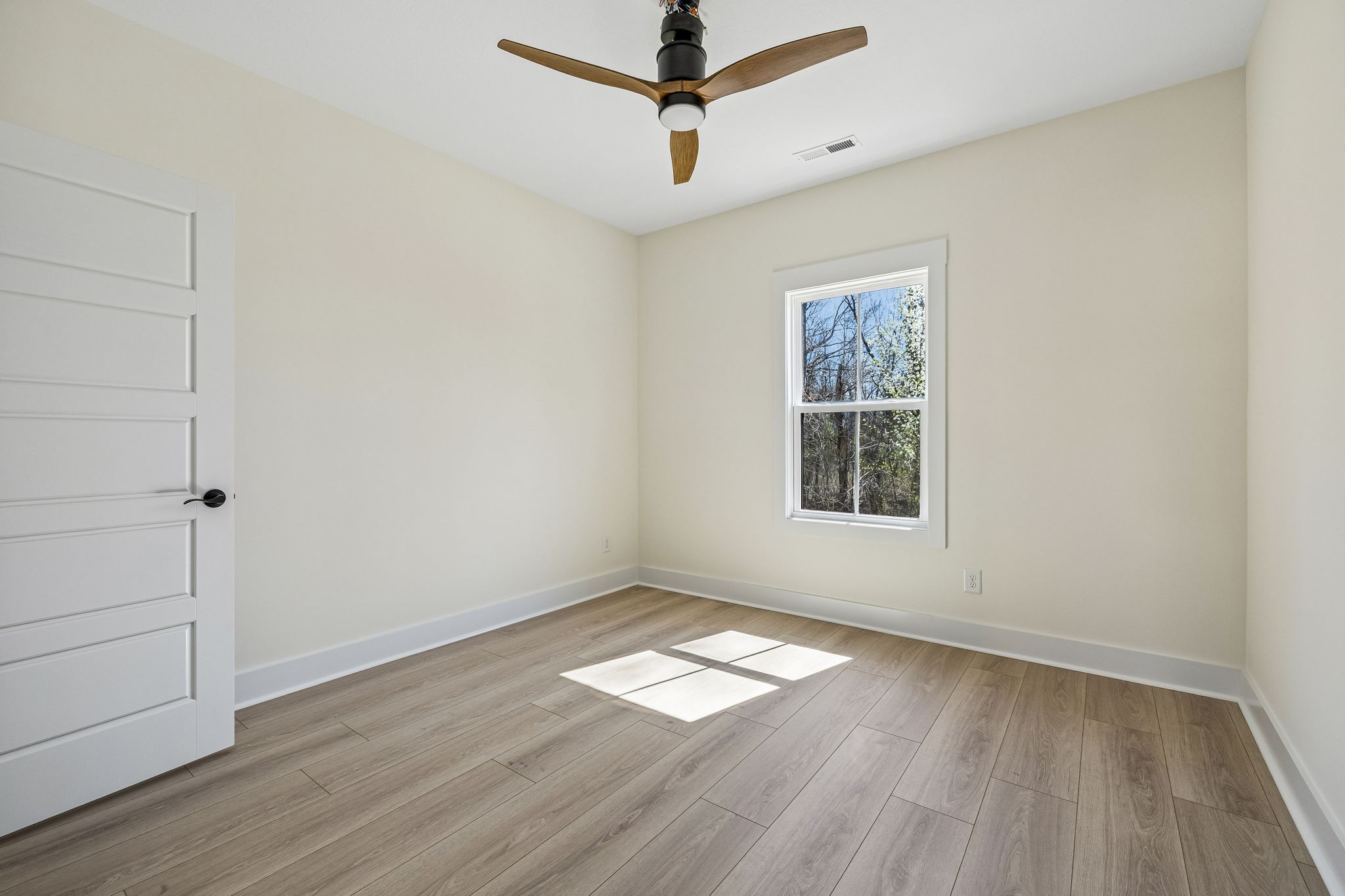2107 Chivalry Way Clarksville, TN 37040 - Photo 8 of 9 a view of empty room with wooden floor and fan