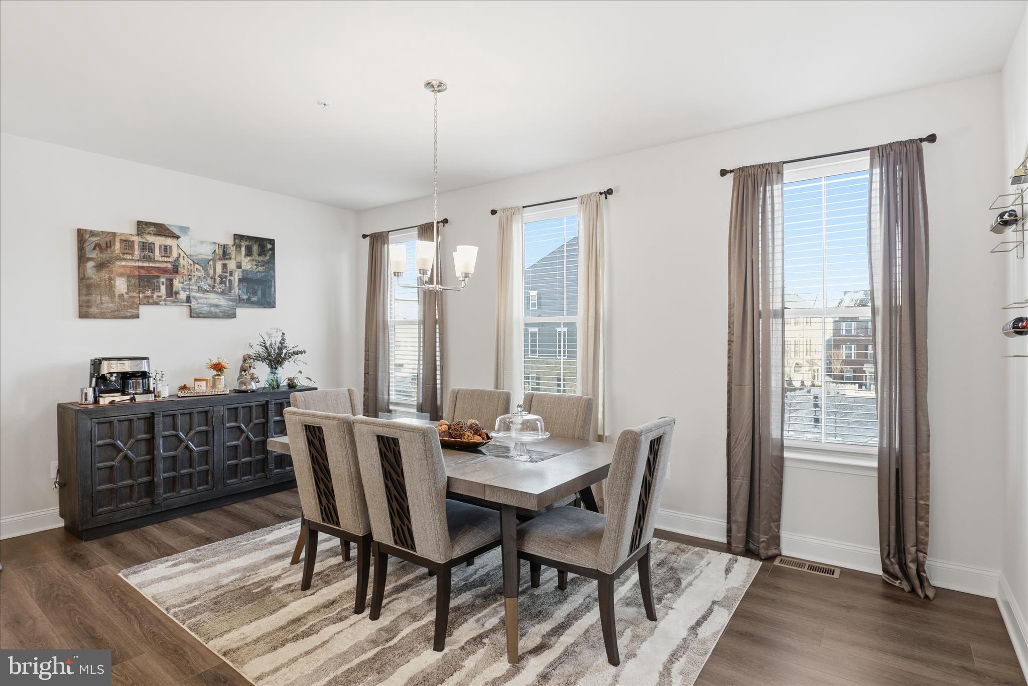16416 Fife Way Bowie, MD 20716 - Photo 14 of 43 a view of a dining room with furniture window and wooden floor