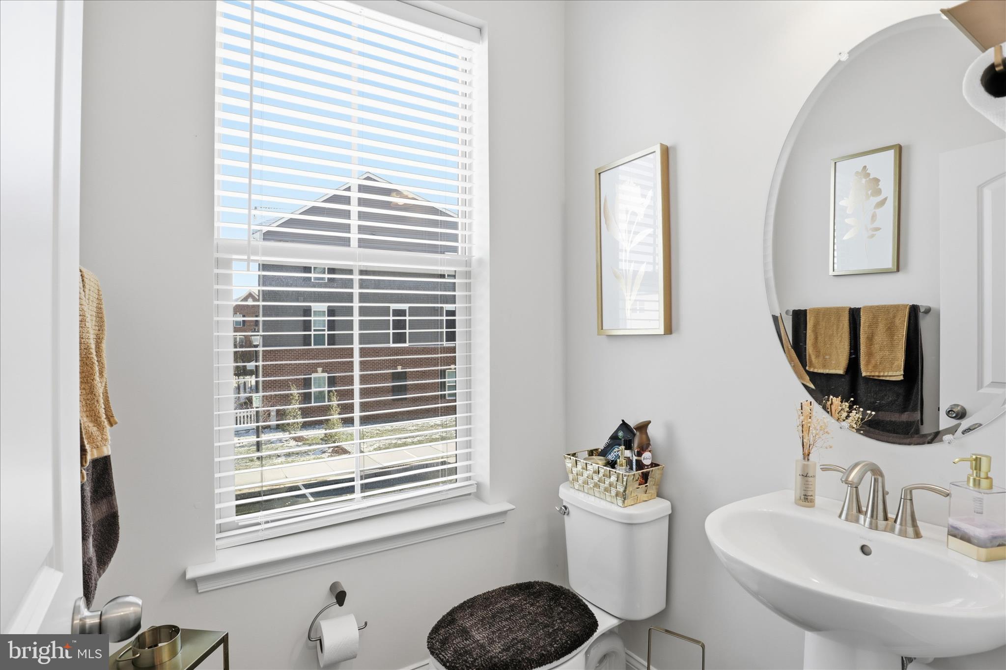 16416 Fife Way Bowie, MD 20716 - Photo 16 of 43 a bathroom with a sink a window and a mirror