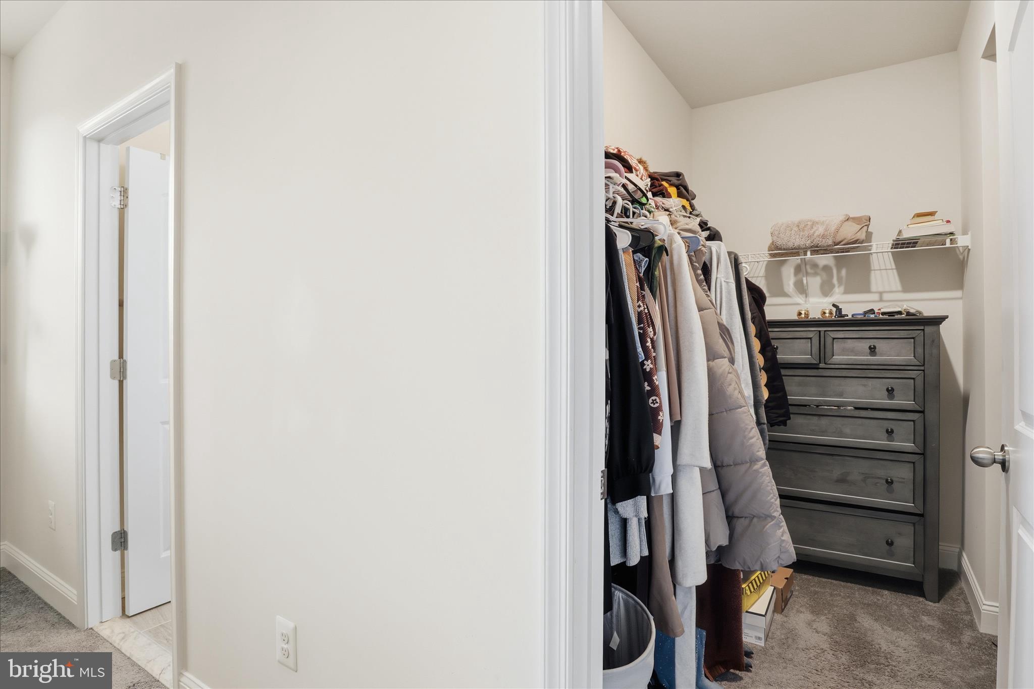 16416 Fife Way Bowie, MD 20716 - Photo 22 of 43 a view of walk in closet with clothes
