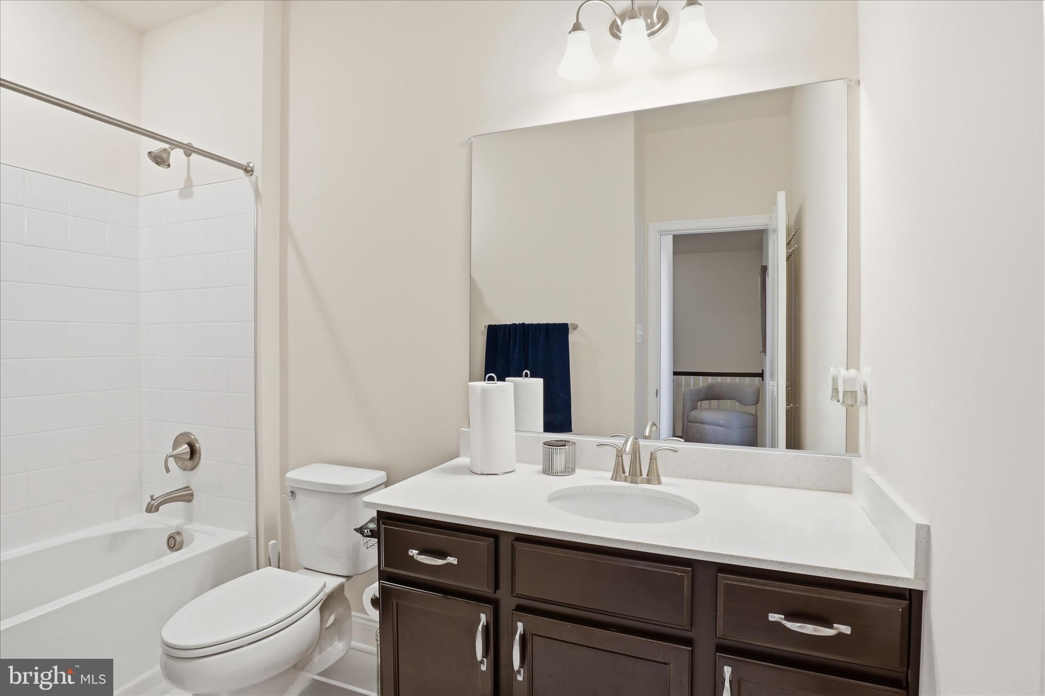 16416 Fife Way Bowie, MD 20716 - Photo 27 of 43 a bathroom with a sink a toilet a mirror and shower