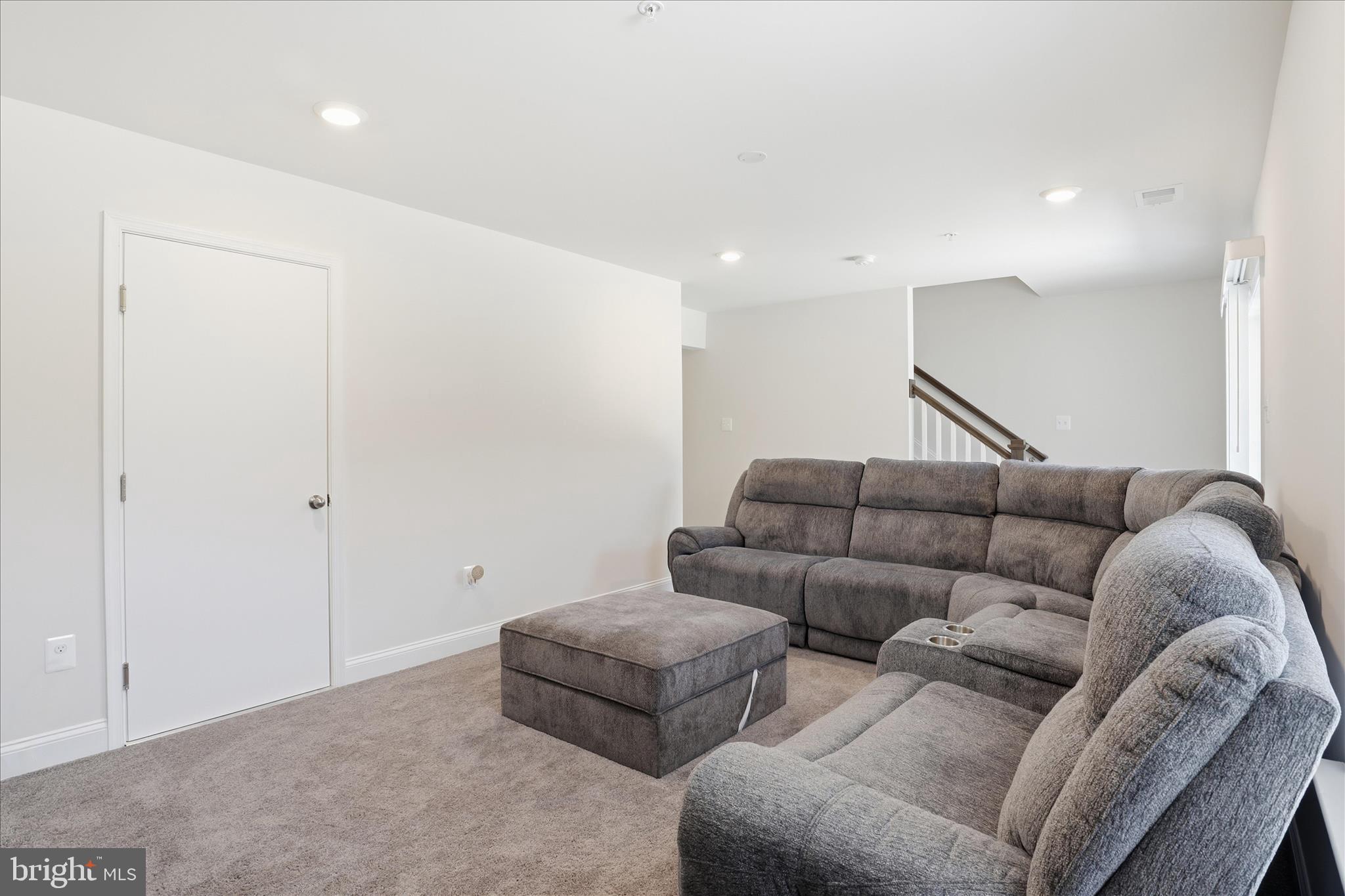 16416 Fife Way Bowie, MD 20716 - Photo 31 of 43 a living room with furniture and a ceiling fan