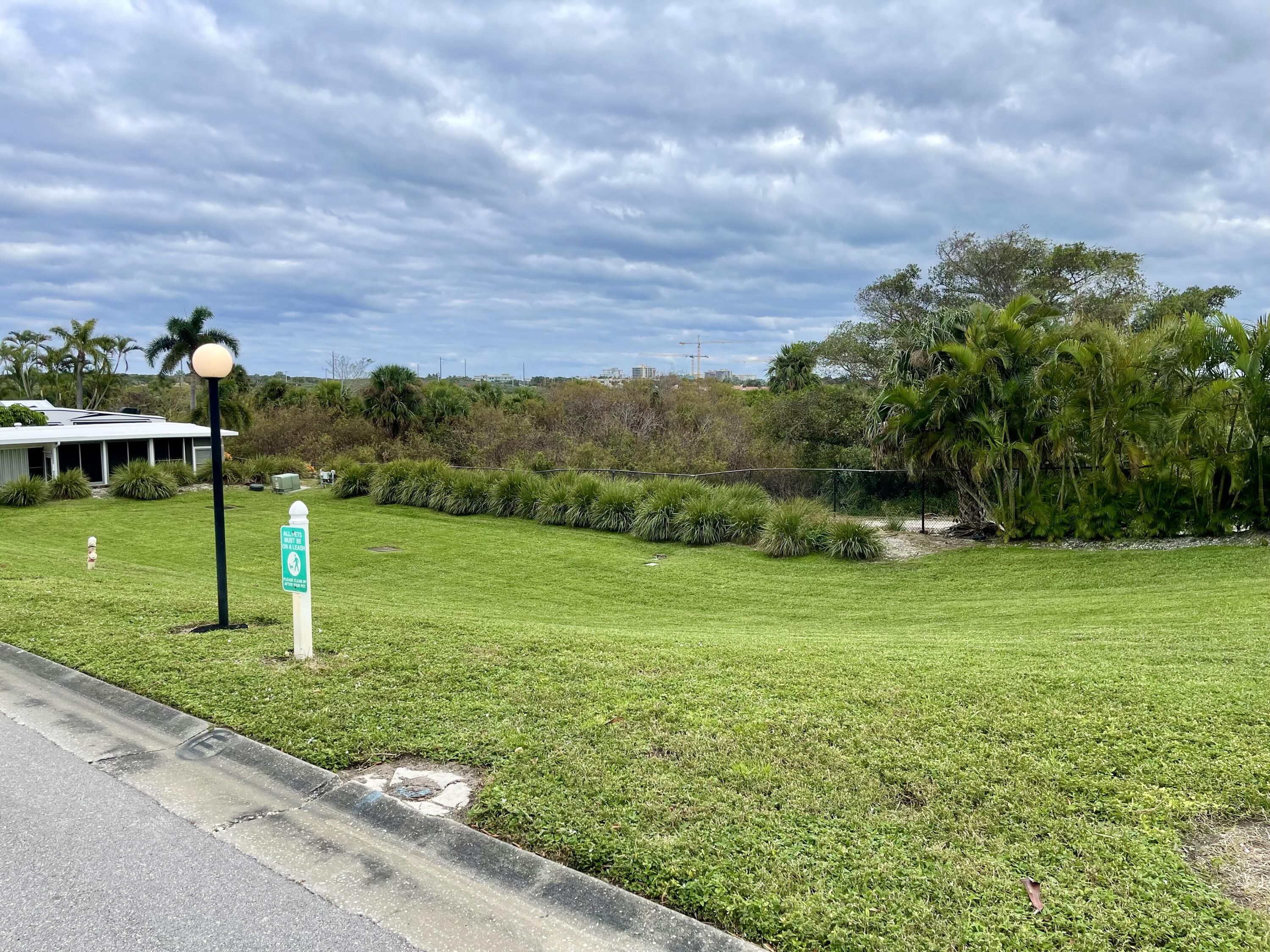 900 Juno Ocean Walk, Unit C34 Juno Beach, FL 33408 - Photo 11 of 20 a view of a golf course with a garden