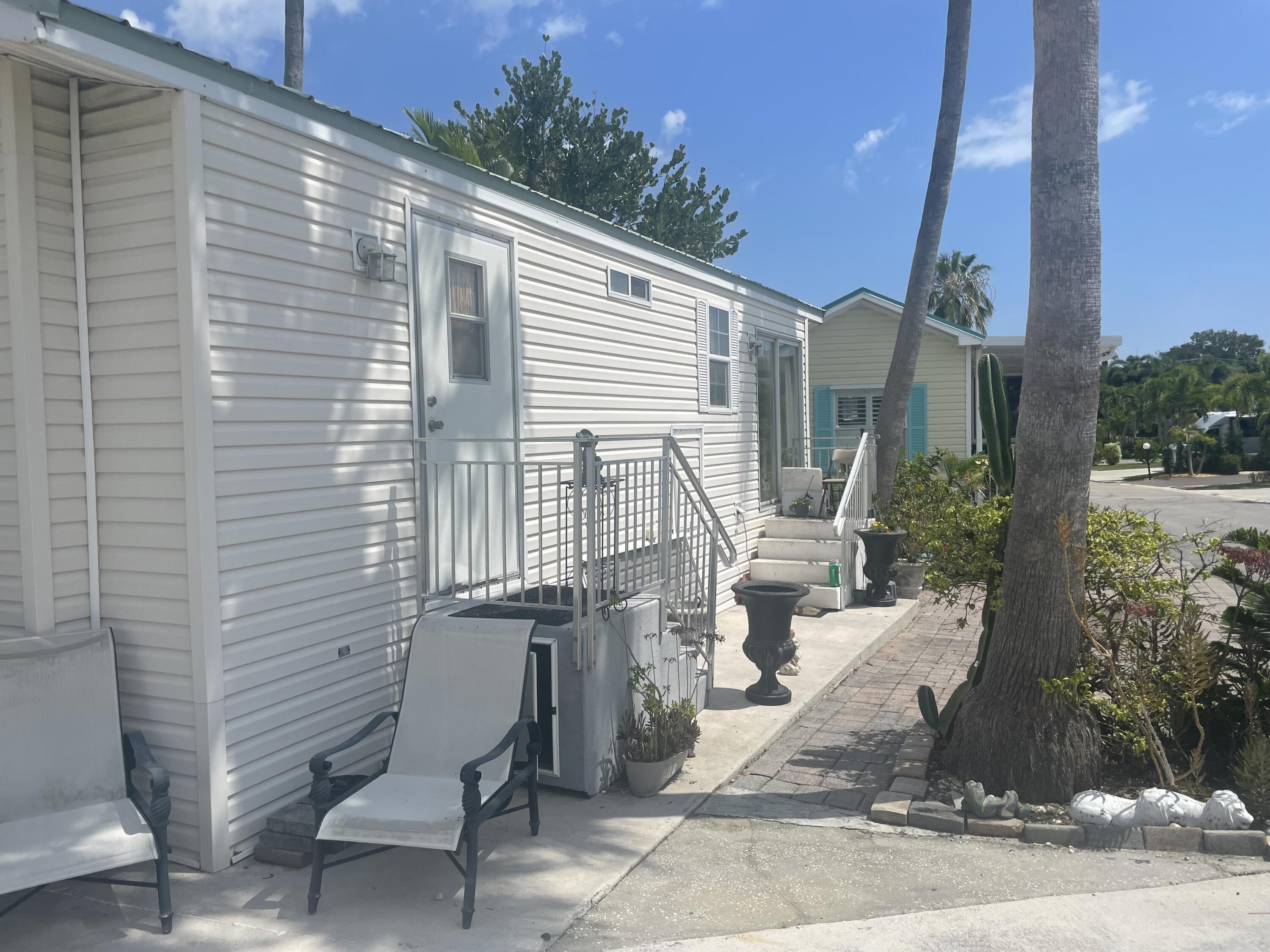900 Juno Ocean Walk, Unit C34 Juno Beach, FL 33408 - Photo 18 of 20 a front view of a house with outdoor seating