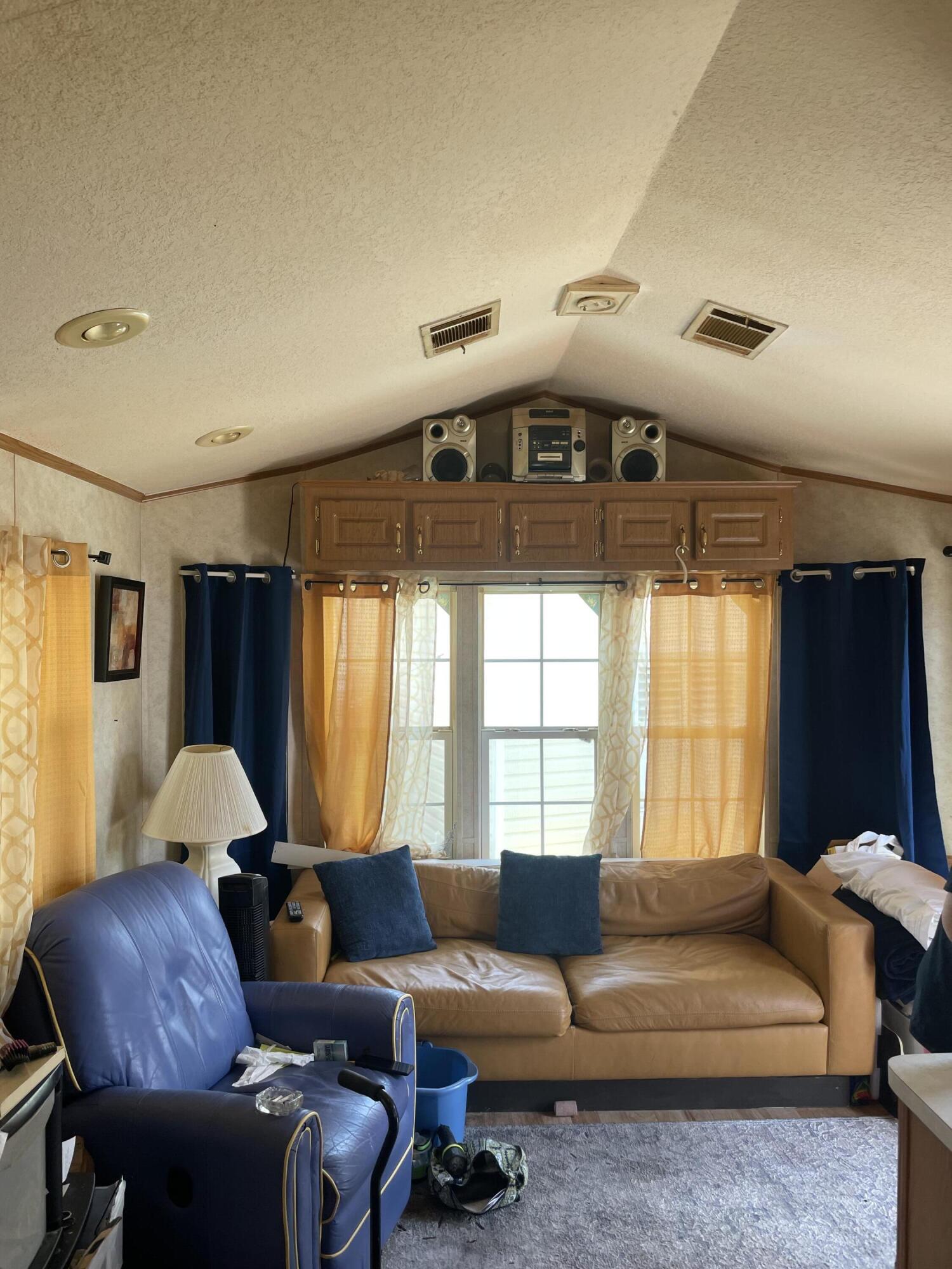 900 Juno Ocean Walk, Unit C34 Juno Beach, FL 33408 - Photo 20 of 20 a living room with furniture and a window