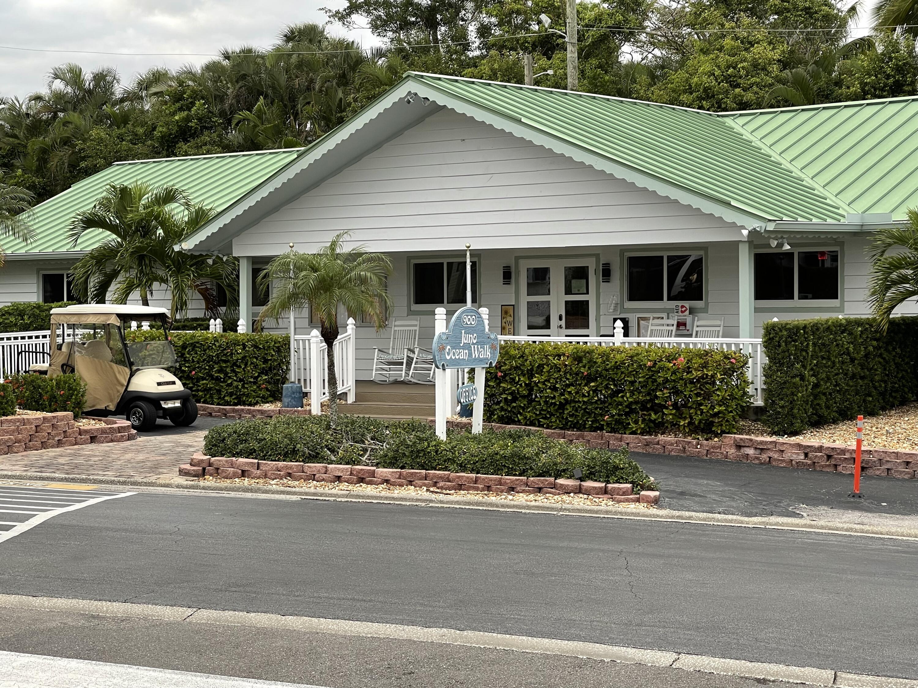 900 Juno Ocean Walk, Unit C34 Juno Beach, FL 33408 - Photo 4 of 20 a front view of a house with a garden