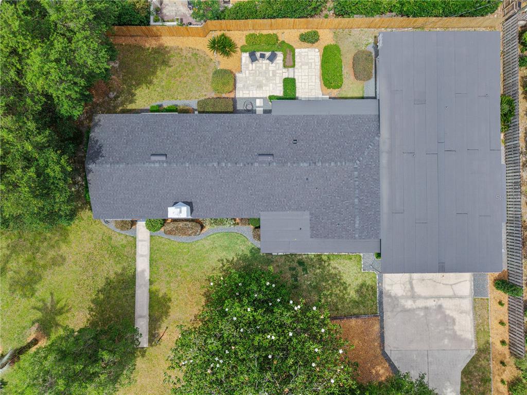 2002 Northwest 11th Road Gainesville, FL 32605 - Photo 3 of 53 aerial view of a house with a yard and a large tree