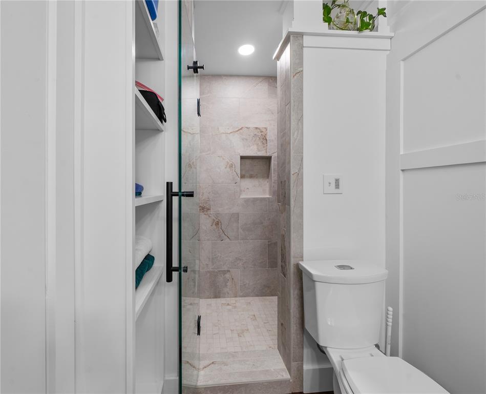 2002 Northwest 11th Road Gainesville, FL 32605 - Photo 33 of 53 a bathroom with a shower and toilet