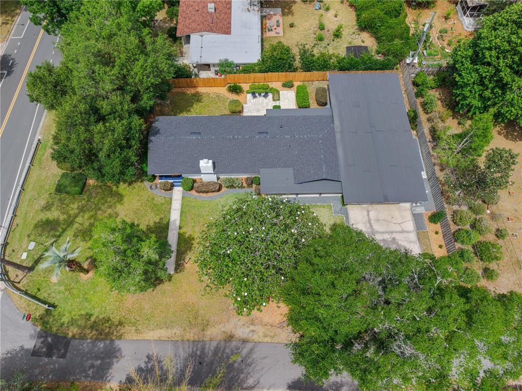 2002 Northwest 11th Road Gainesville, FL 32605 - Photo 4 of 53 an aerial view of a house with a yard and large trees
