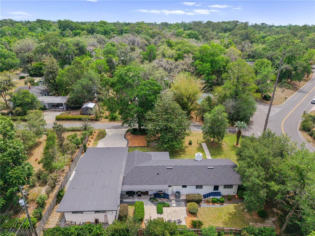 2002 Northwest 11th Road Gainesville, FL 32605 - Photo 5 of 53 an aerial view of a house with a yard basket ball court and outdoor seating