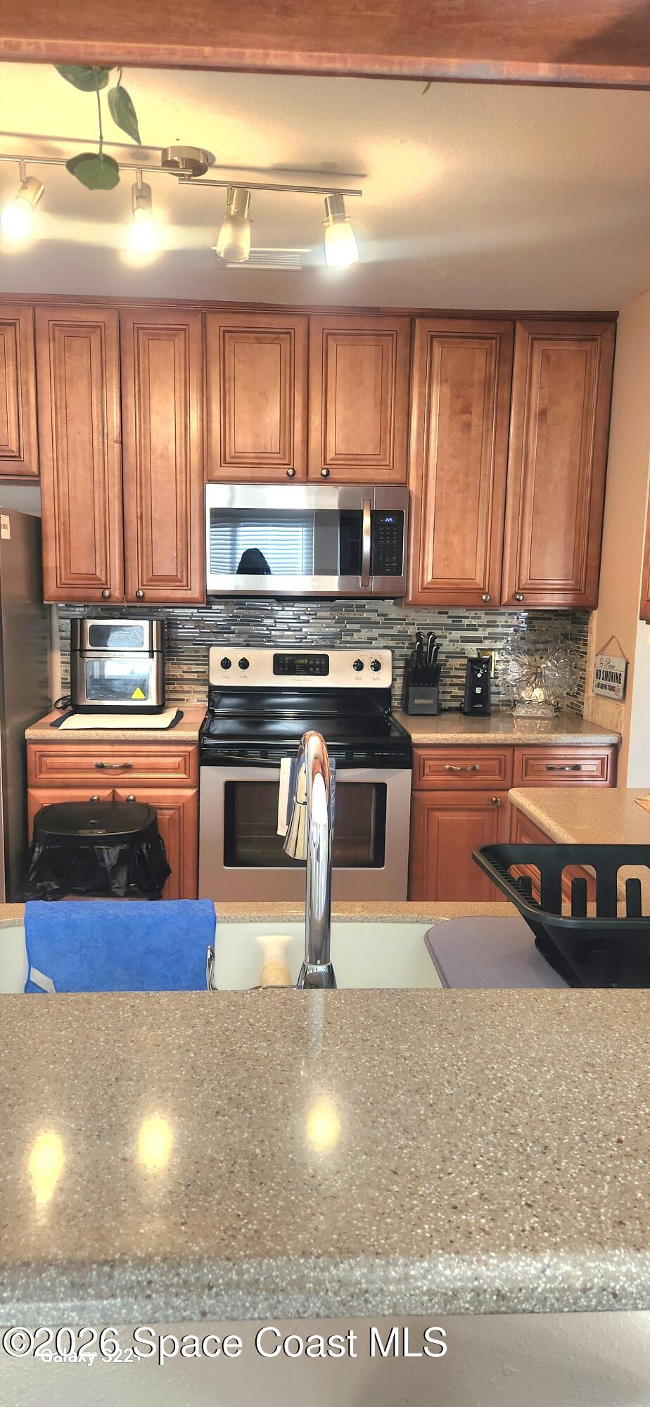 1327 Cherry Hills Road Northeast Palm Bay, FL 32905 - Photo 11 of 20 1327 cherry hills kitchen wfaucet