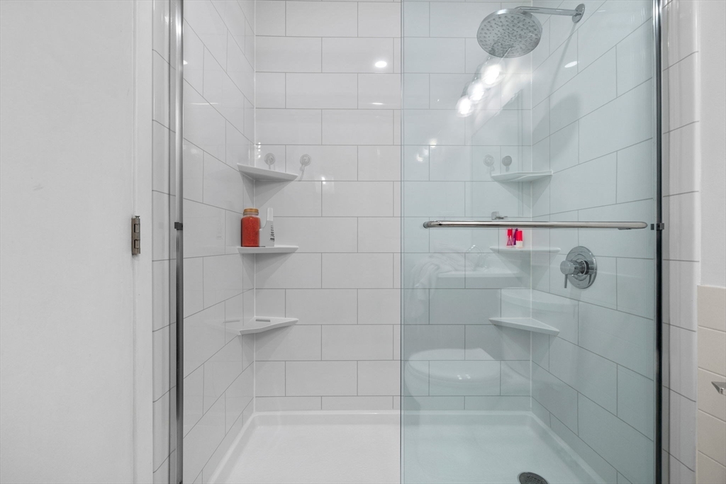 269 Cambridge Road, Unit 203 Woburn, MA 01801 - Photo 17 of 26 a bathroom with a shower