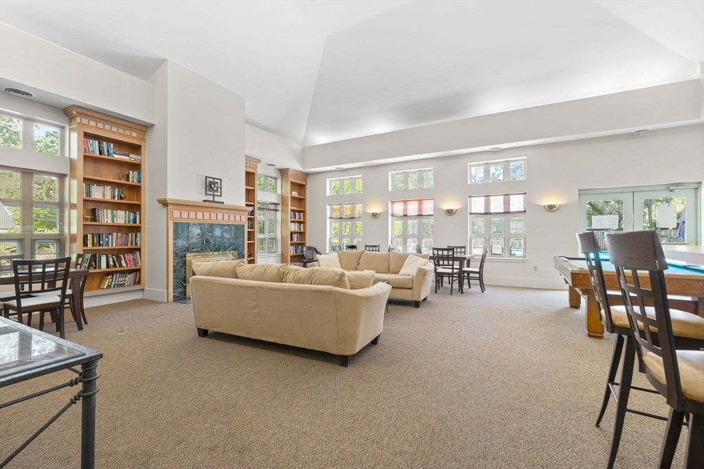 269 Cambridge Road, Unit 203 Woburn, MA 01801 - Photo 19 of 26 a living room with furniture and a table