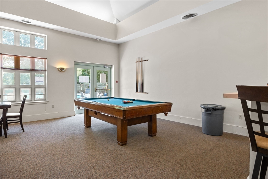 269 Cambridge Road, Unit 203 Woburn, MA 01801 - Photo 21 of 26 a room with pool table and windows
