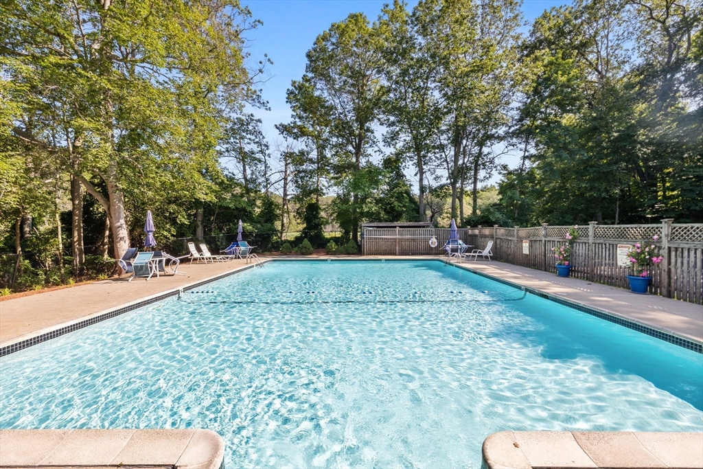 269 Cambridge Road, Unit 203 Woburn, MA 01801 - Photo 23 of 26 a view of outdoor space with deck and trees