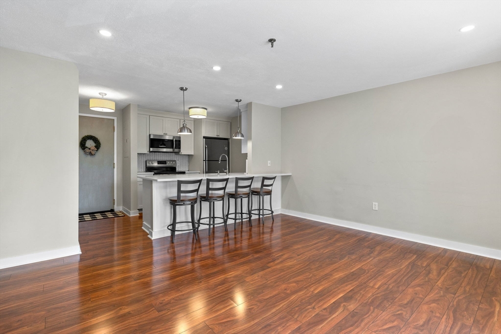 269 Cambridge Road, Unit 203 Woburn, MA 01801 - Photo 5 of 26 a view of kitchen with stainless steel appliances refrigerator microwave and stove