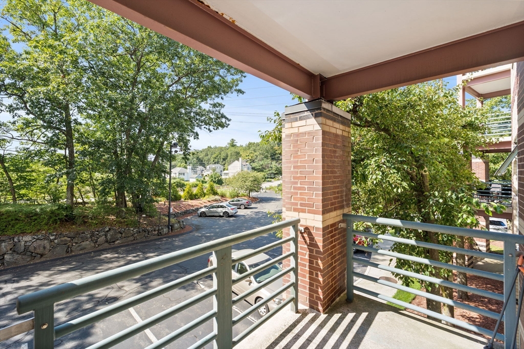 269 Cambridge Road, Unit 203 Woburn, MA 01801 - Photo 10 of 26 a view of a city from a balcony