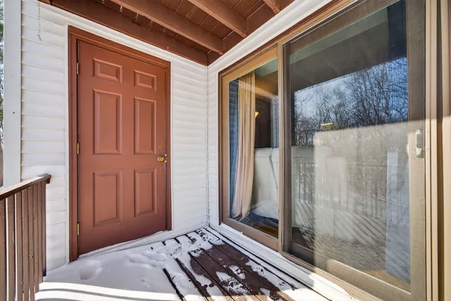 a view of a door and a window