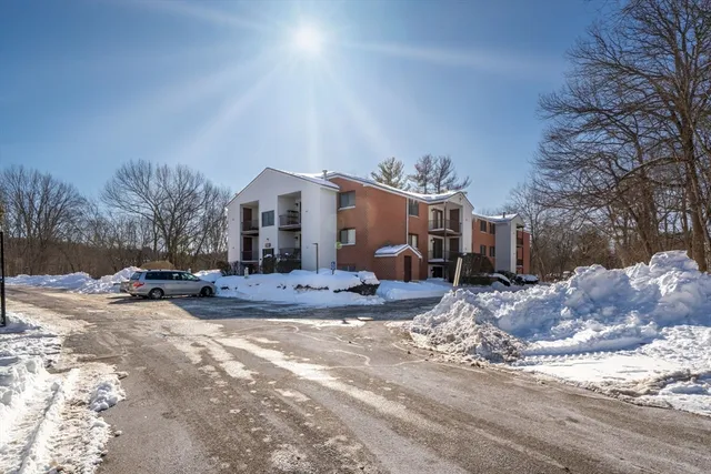 a view of a house with a snow in the yard