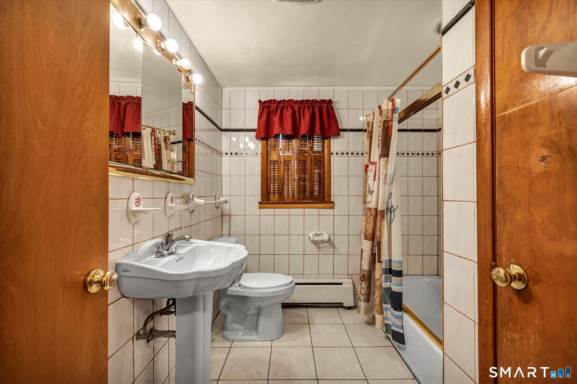 740 Rainbow Road Windsor, CT 06095 - Photo 20 of 40 a bathroom with a sink and mirror
