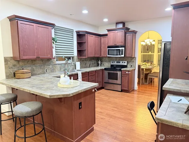 a bathroom with a sink toilet and mirror
