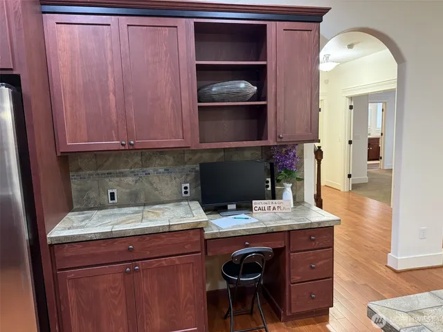 a white bath tub sitting next to a white sink