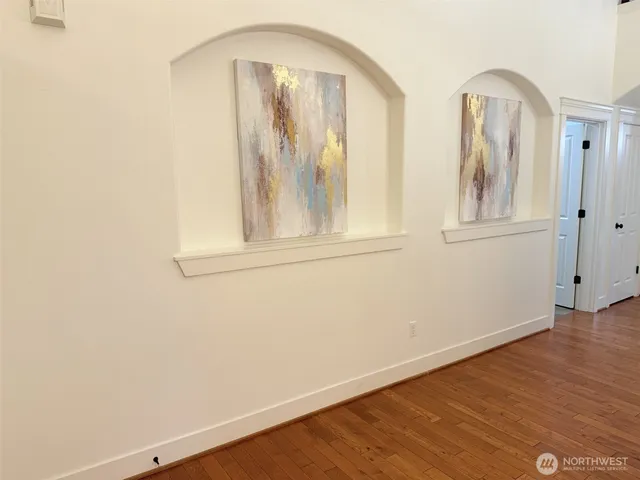 a large kitchen with a table and chairs