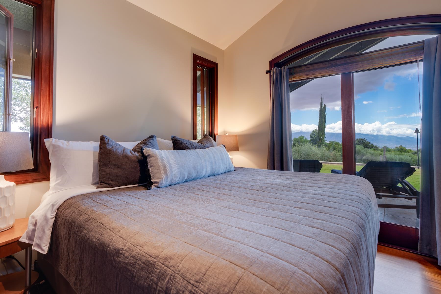 707 Calasa Road Kula, HI 96790 - Photo 16 of 50 a large bed sitting in a bedroom next to a window