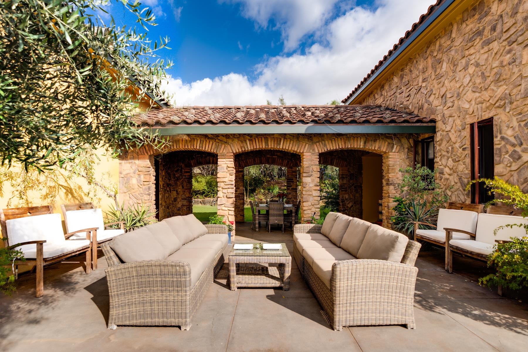 707 Calasa Road Kula, HI 96790 - Photo 23 of 50 a building outdoor space with patio furniture