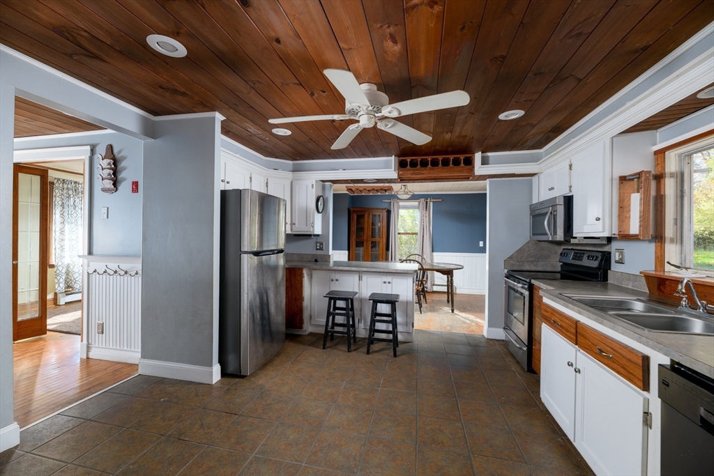 190 Summer Street Barre, MA 01005 - Photo 11 of 25 a kitchen with stainless steel appliances granite countertop a sink refrigerator and cabinets