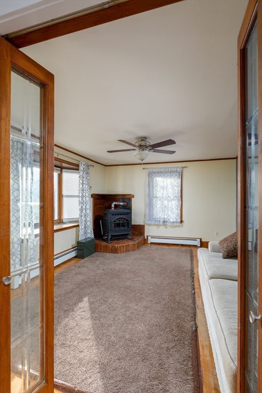190 Summer Street Barre, MA 01005 - Photo 13 of 25 a view of an empty room with a fireplace and a window