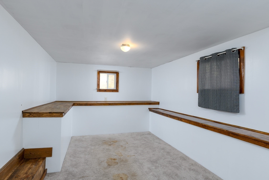 190 Summer Street Barre, MA 01005 - Photo 19 of 25 a view of an empty room with wooden floor and a window