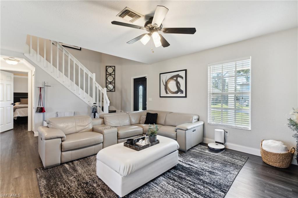 8457 Wren Road Fort Myers, FL 33967 - Photo 15 of 50 Living room with dark hardwood / wood-style floors and ceiling fan