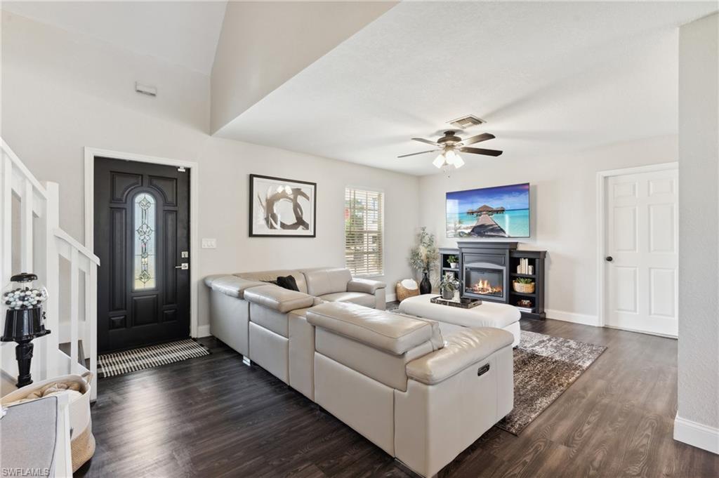 8457 Wren Road Fort Myers, FL 33967 - Photo 16 of 50 Living room with ceiling fan and dark hardwood / wood-style flooring