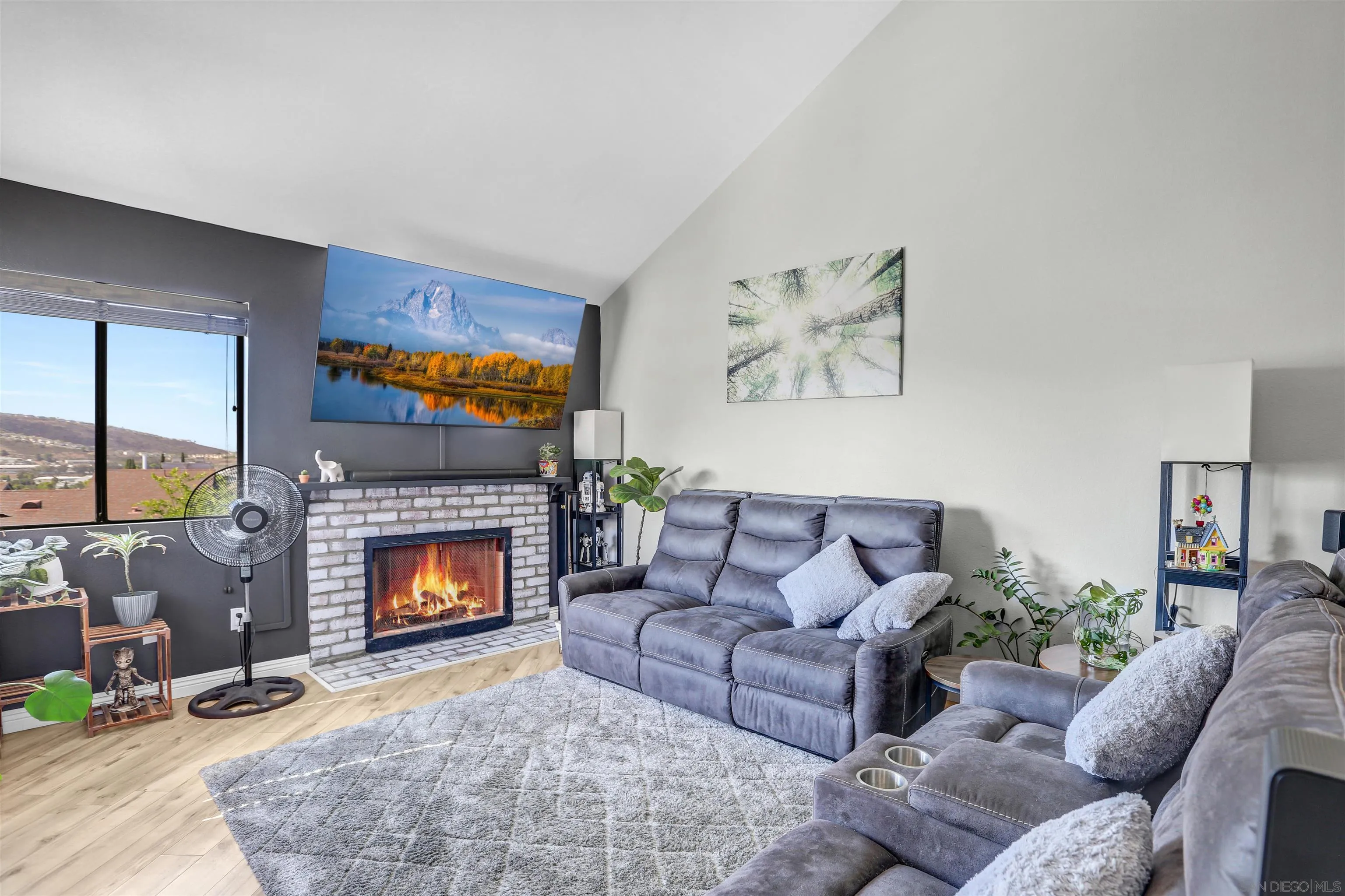a living room with furniture and a fireplace