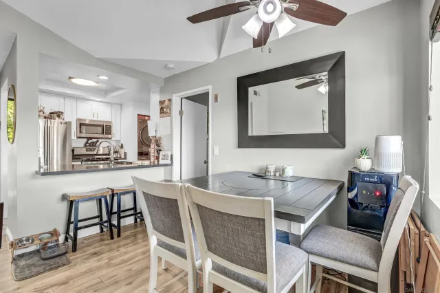 a view of a dining room with furniture and wooden floor