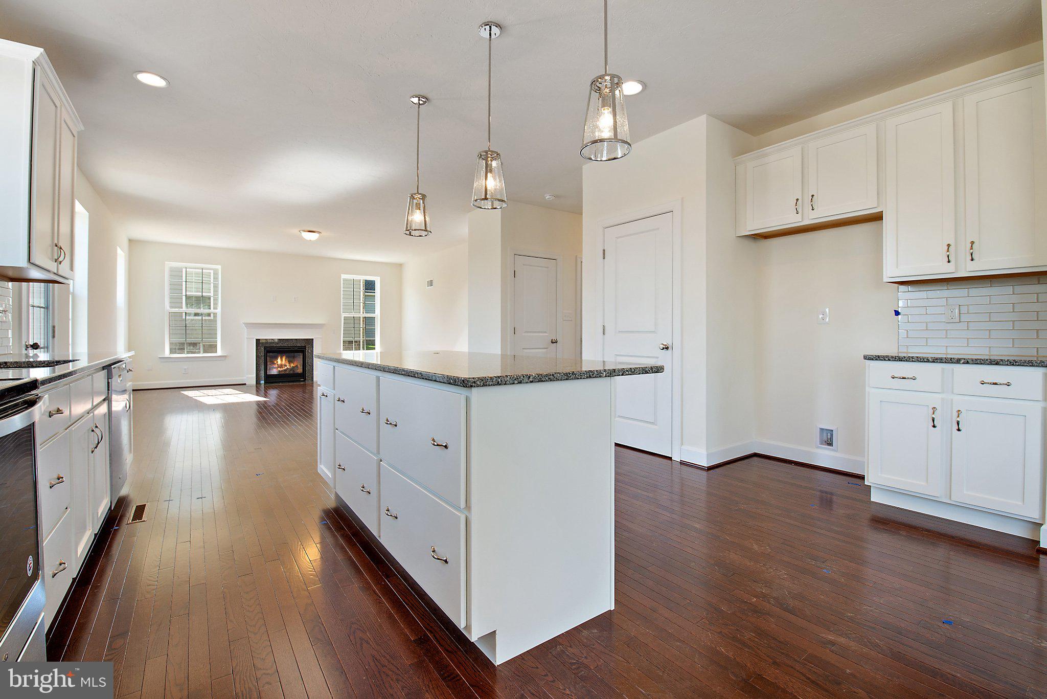 53 Bright Lane Hanover, PA 17331 - Photo 9 of 21 an open kitchen with wooden floor and large windows