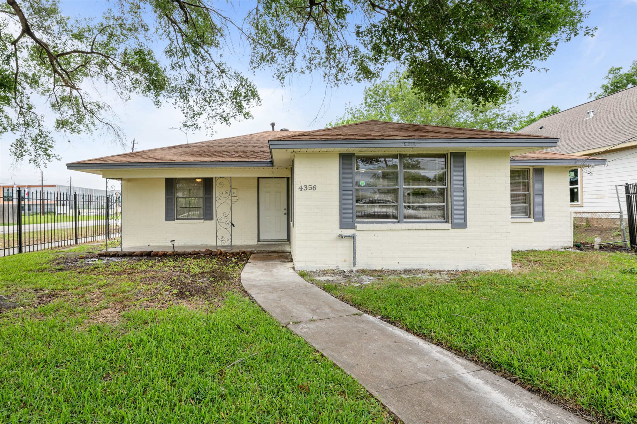 4356 Phlox Street Houston, TX 77051 - Photo 1 of 25 a front view of a house with a yard