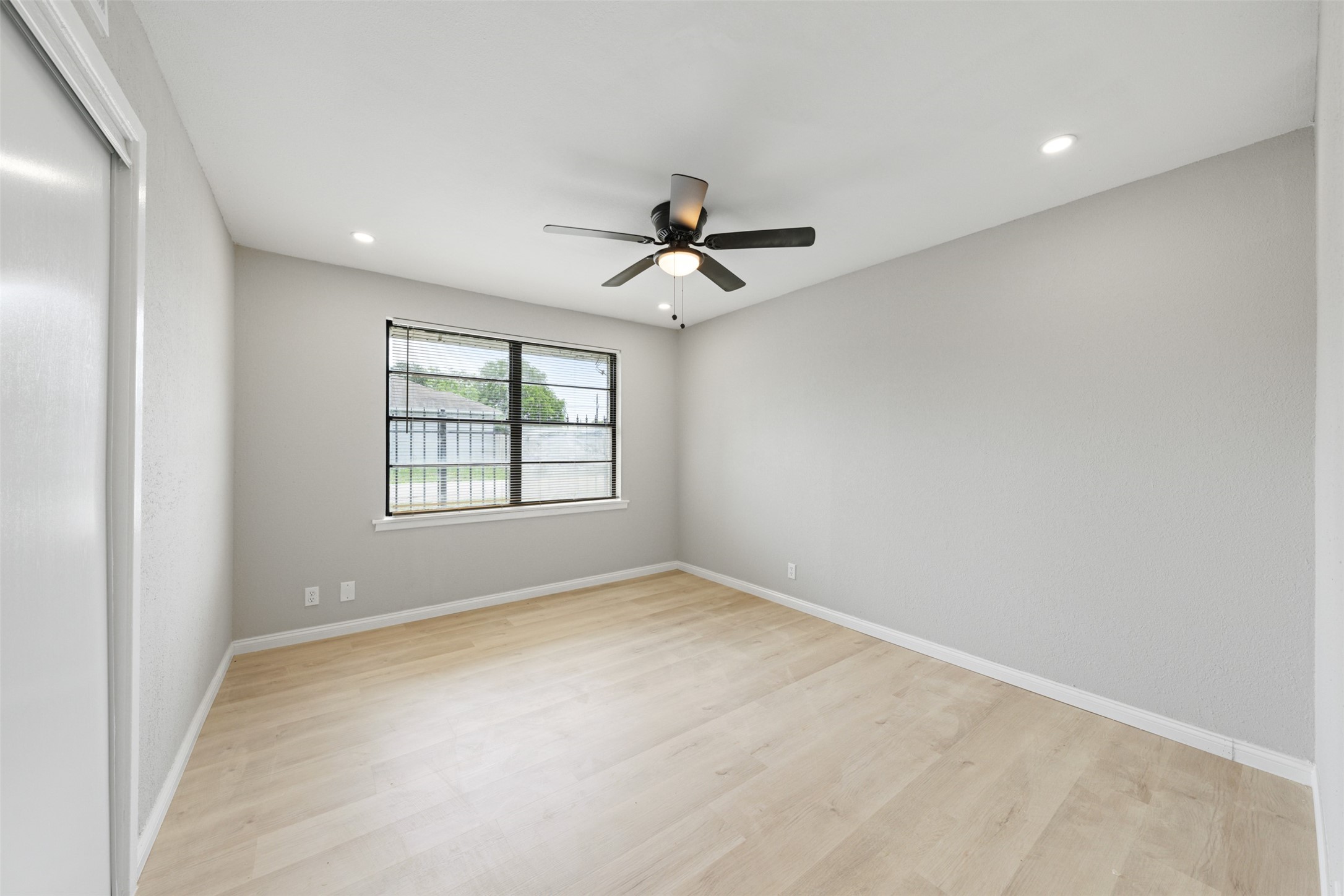 4356 Phlox Street Houston, TX 77051 - Photo 22 of 25 wooden floor in an empty room with a window