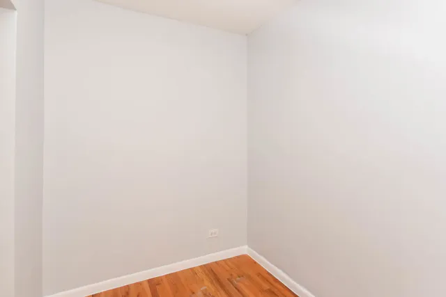a view of a small space with wooden floor