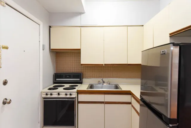 a kitchen that has a sink and a stove