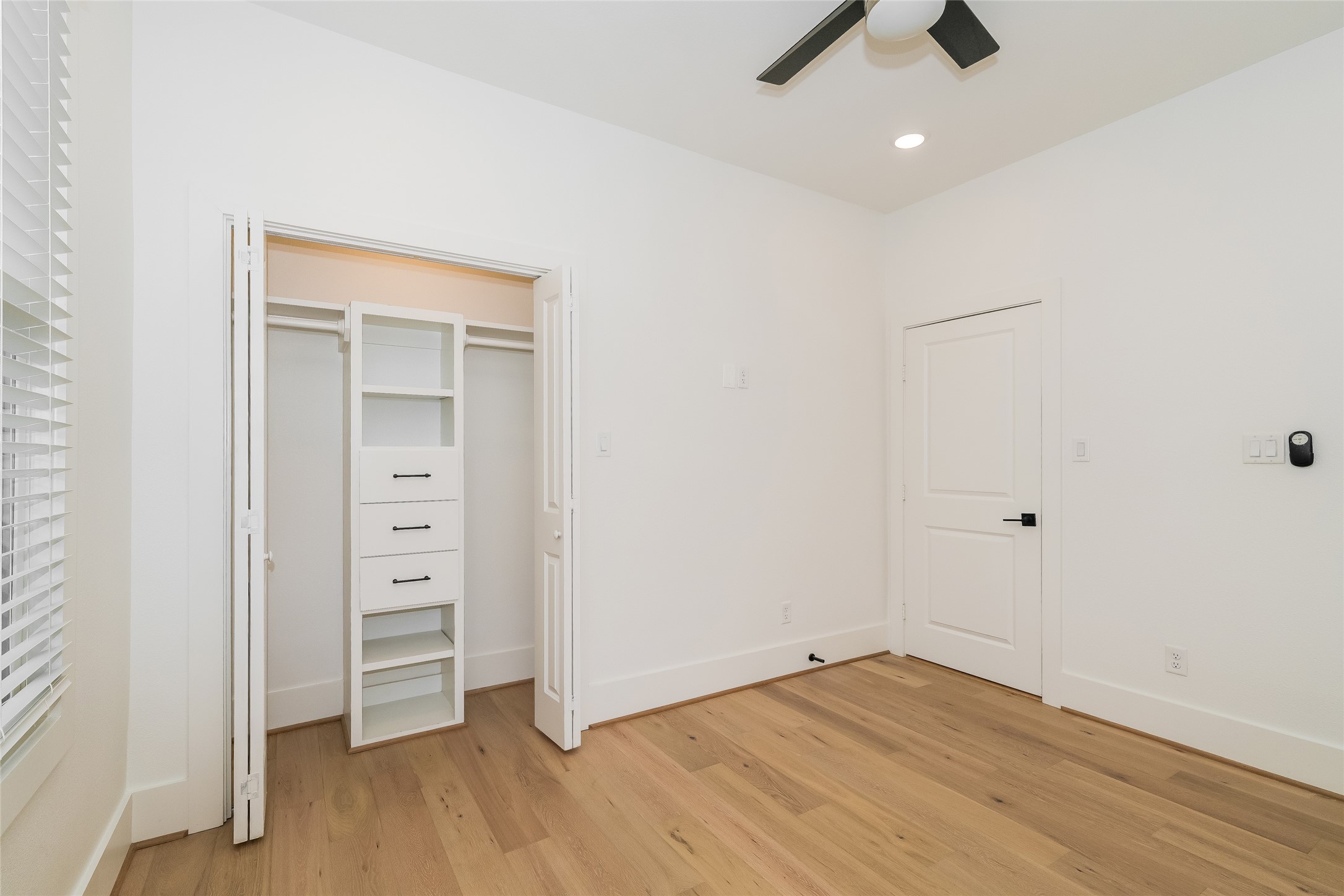 231 Grace Street Houston, TX 77003 - Photo 13 of 15 an empty room with wooden floor and closet