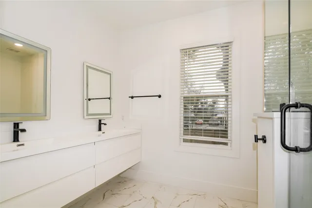 a bathroom with a bathtub and a sink
