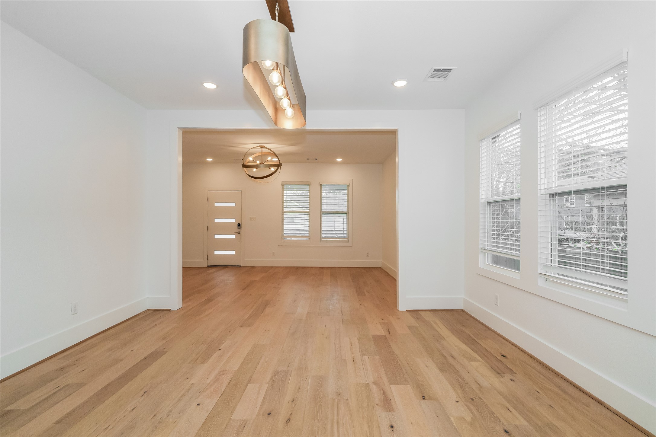 231 Grace Street Houston, TX 77003 - Photo 4 of 15 a view of a livingroom with wooden floor and window