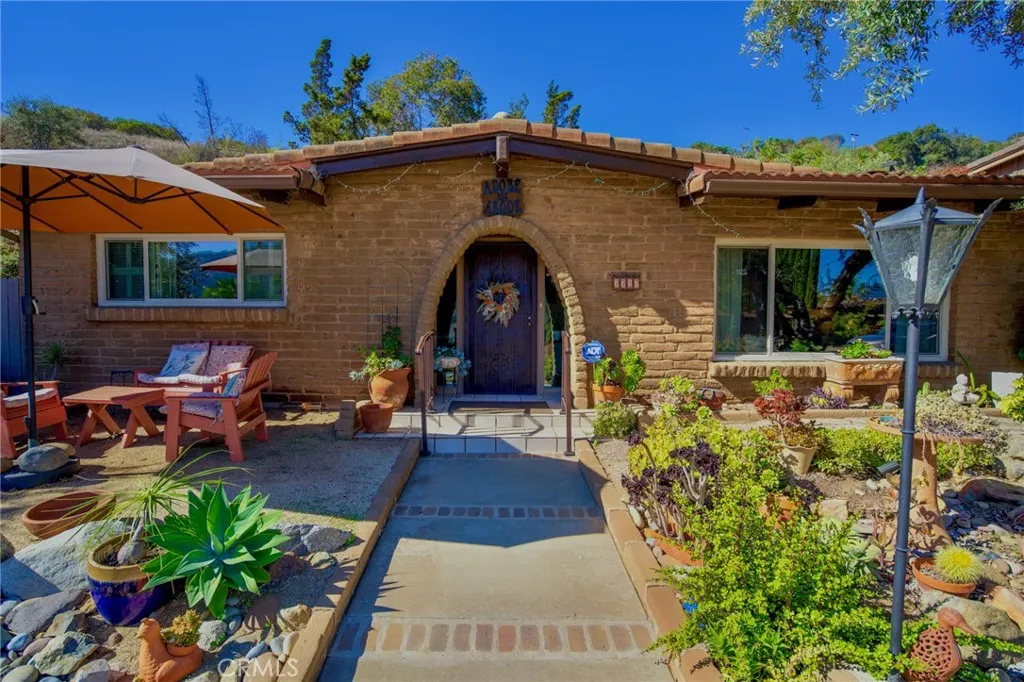 3317 Vía Altamira Fallbrook, CA 92028 - Photo 1 of 1 a front view of a house with garden