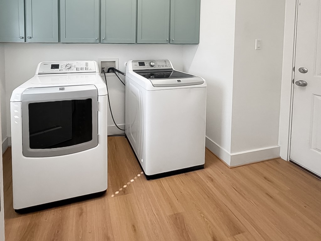 4120 Valley View Road, Unit A Austin, TX 78704 - Photo 12 of 16 Functional laundry space featuring modern washer/dryer and storage
